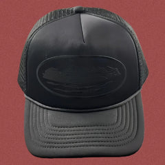 Cortiez All-Black Monochromatic Oval Ship Logo Trucker Hat